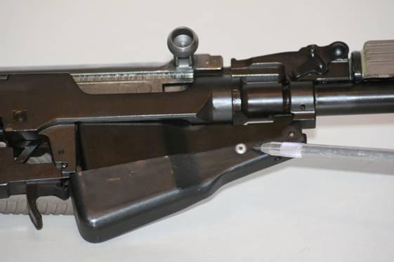 Factory magazine modification: To make the factory magazine detachable and for ease of reassembly. 1-The small spot-welded lug on the rear of the magazine must be removed.