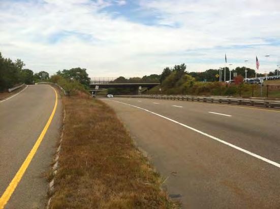 The width of the existing sidewalk on the bridge over Route 1, on the north side of the rotary, was deemed to be too narrow for ease of maintenance by the Town, which hinders winter maintenance.