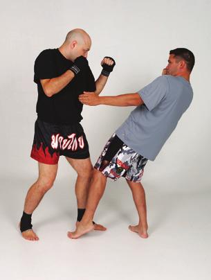 Elbow Thrust: From the tie-up position, thrust both elbows forward, leading with the tips.