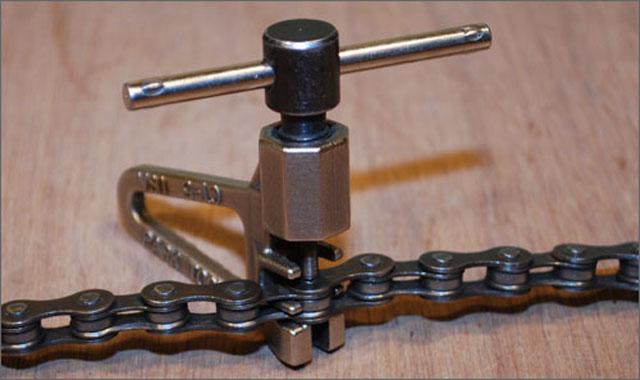 teeth when switching gears. Figure 3 - A bicycle chain link tool When bicycle building becomes your hobby, one of those "must have" tools will be a chain link tool as shown in Figure 3.