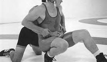 Offensive wrestler is not allowed to lock (overlap) hands, fingers, wrists or arms around body