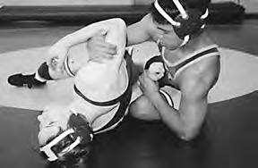 The hammerlock is a legal hold, provided the hand is not forced away from the body.