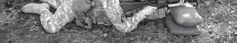 Legs are spread apart with the firing leg bent to relieve pressure on the lower body. The prone supported firing position uses sandbags or any other suitable object to support the handguard.