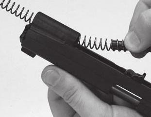 Keep the plug contained with both hands and allow the recoil spring to fully extend (see Figure 6).