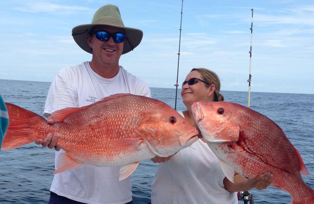 Captain Ken Kennickell and Captain Deidra Helmey Jeffcoat of Miss Judy Charters with two very nice genuine red snapper!