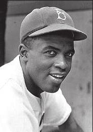 On June 24, 1947, Jackie Robinson steals home against the Pittsburgh Pirates, helping the Brooklyn Dodgers to a 4-2 win.