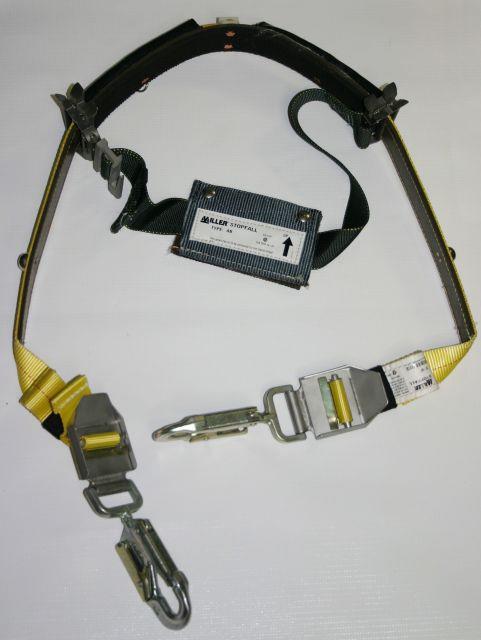 Double legged Shock Absorbing Lanyard Are attached to a dorsal D ring and used to alternate attachment when necessary.
