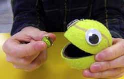 Feed the ball Get your child to hold marbles in one hand and the ball in the other hand. Encourage your child to manipulate marbles from palm of hand to finger tips.