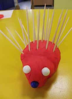 Use beads for eyes and nose and use cocktail sticks for the spikes and place into the playdoh.