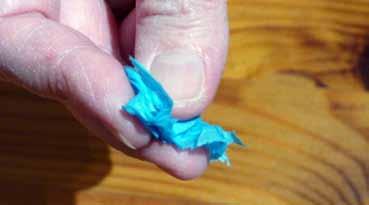 Tissue paper Encourage tearing of tissue paper and scrunch pieces of paper into small balls by rolling with