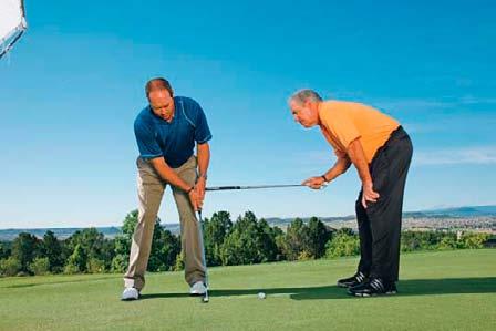 Practice putting left-hand-only (above), or have someone hold a club in front of your hands on the target line.