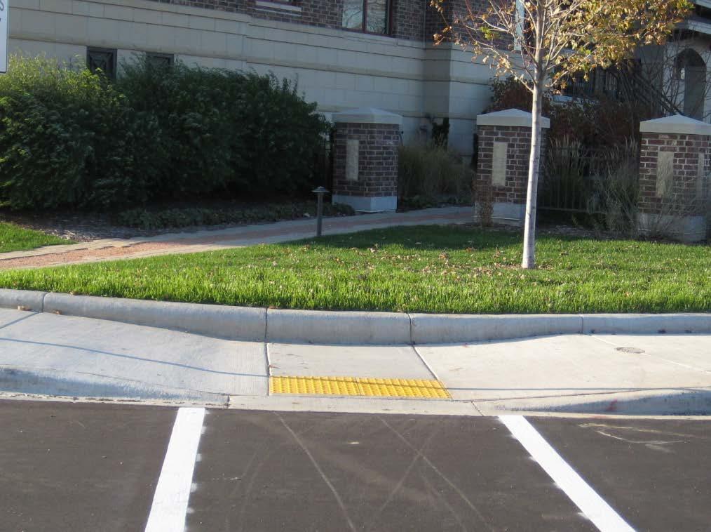Lowering of sidewalk near curb ramp may