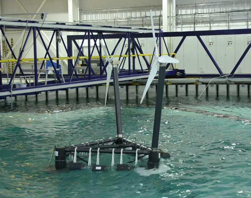The model, ready to be tested without wave converters, is shown in Figure 6. Behind the model is the absorption beach to reduce the reflected waves in the tank.