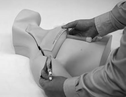 Hold here Set the pad on the torso Putting the pulsation unit through the opening in the right shoulder of the