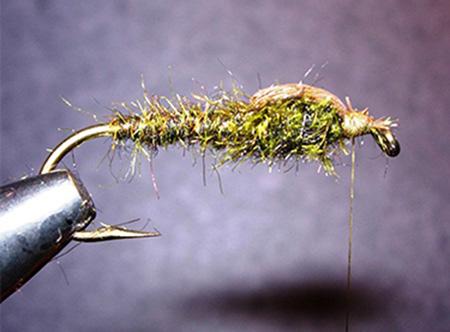 The Leader July 2015 Fly Tyer s Corner - Continued from Page 8 5. Cut a small bunch of brown deer hair, clean it, and tie it in by the tips in front of the abdomen with the butts pointing to the rear.