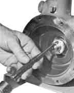 If the cover is stuck, use two cover screws in the threaded holes to loosen it. 3. Remove the impeller key (No.