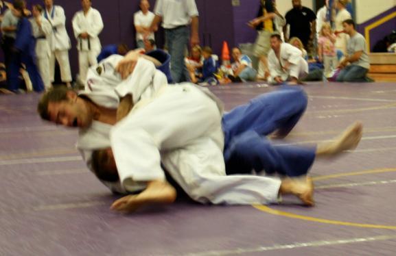 control. 2-The defender manages to use his right hand and arm to post onto the mat as a defensive move. 3-The defender is thrown but not with sufficient control to merit the score of Ippon.