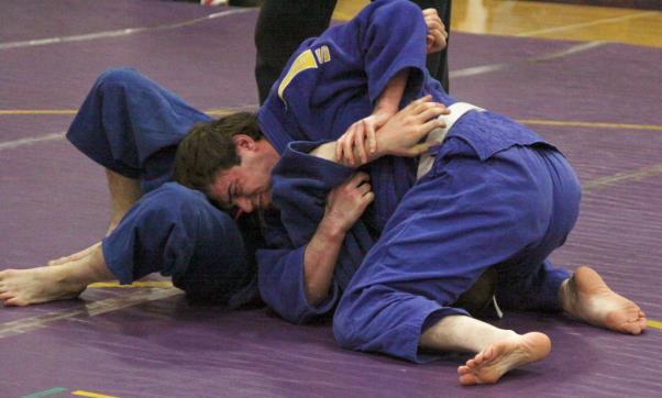 (This photo shows the referee doing this.) At this time, the judoka applying the pin must attempt a choke or armlock on his opponent.