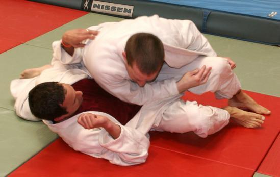 FIGHTING FROM THE GUARD A position that was invented in the early years of judo and now used in almost all forms of jujitsu and submission grappling