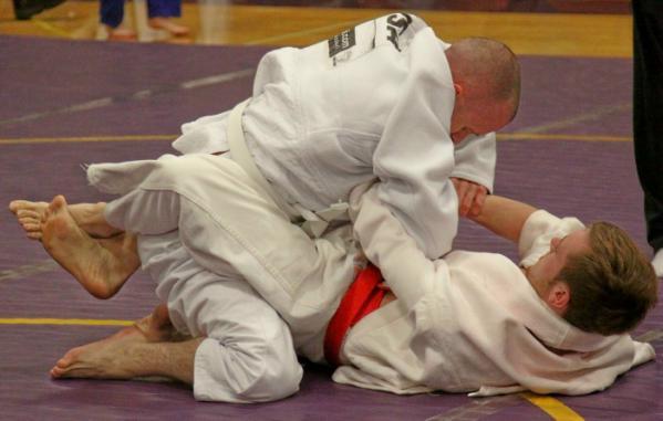 then past his hip showing control, the attacker earns 1 point for a guard pass.