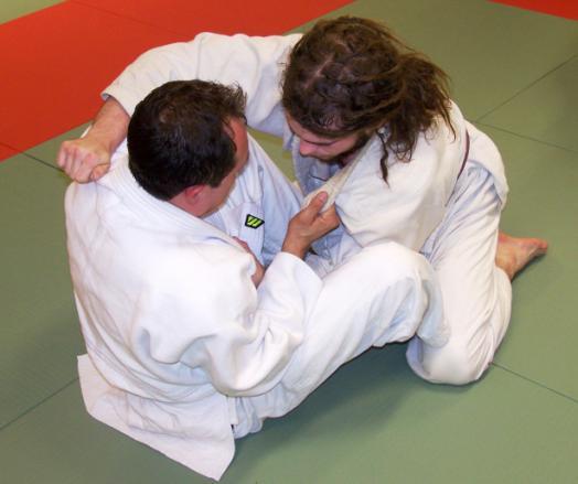 GUARD SWEEP The attacker is on the bottom (in the guard or similar position) and rolls or sweeps his