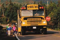 4.5 School Zones, School Buses and Construction Zones If you are approaching a school bus from the front or the rear that has stopped to take on or discharge passengers as indicated by flashing red