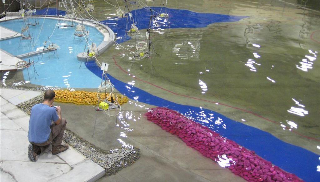 -10 metres, while a purple line was painted to indicate the -15 metre depth contour. A photo of the completed marina model during testing is shown in Figure 3.
