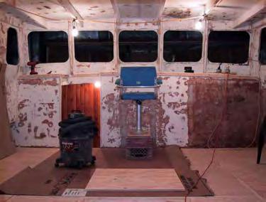 This picture taken from the wheelhouse dash shows the large cavernous interior space of this boat. Further back and down is the aft cabin.