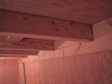 A carved beam from a solid piece of wood was considered, however the engineered composite construction is stronger and