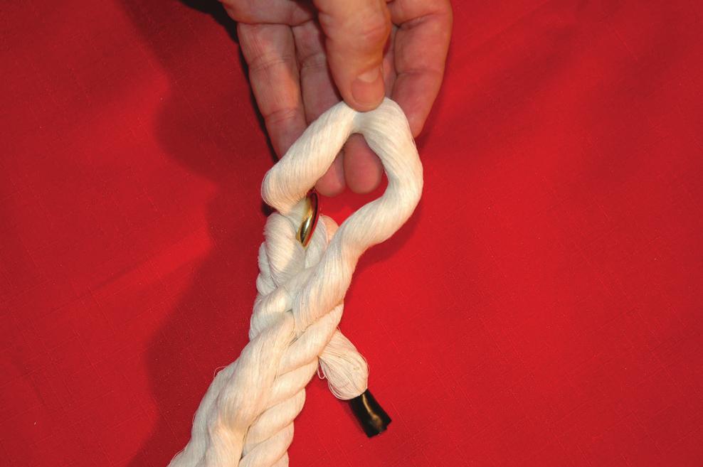 Retighten the plaits and then move the third strand. 6.