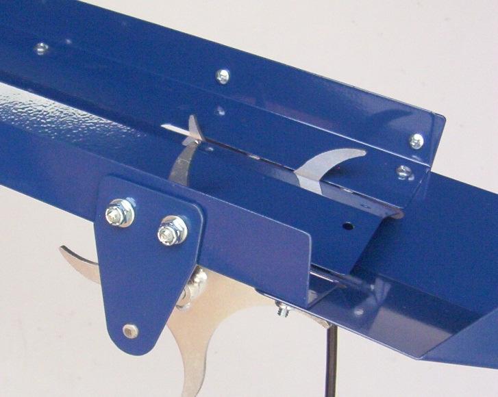 Attach the Shaft Guide (as shown) to the Feeder Tray using the #10-24 x 5/8 Phillips screws, washers, and lock nuts.