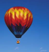 Air is made of mostly nitrogen gas and oxygen gas, which are much denser than helium. When a balloon is filled with helium, its density is less than the density of the surrounding air.