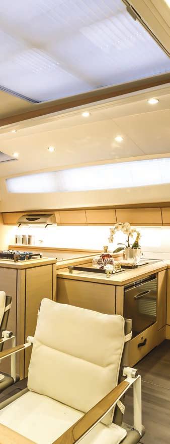 The L-shaped galley features top-end appliances and plenty of storage, above.