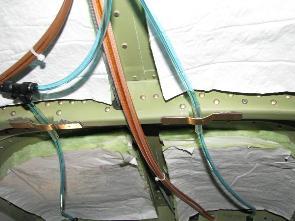 IO-5 Interior Oxygen Installation (cont) Picture: Above Passenger Seats Behind Pilot Seats Install flex tube protectors (Item 54) using