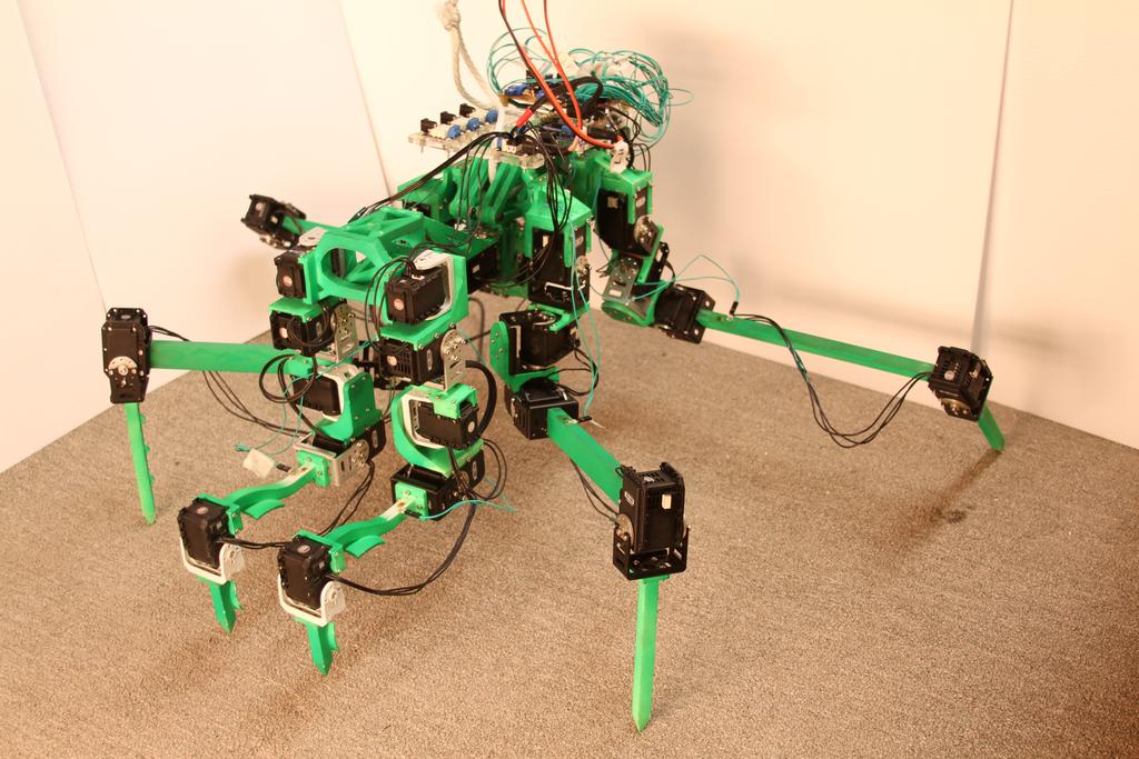 2 MantisBot: A Platform for Real-Time Neural Control Fig. 1. MantisBot can support its own weight on four legs, with the front legs off the ground for striking.