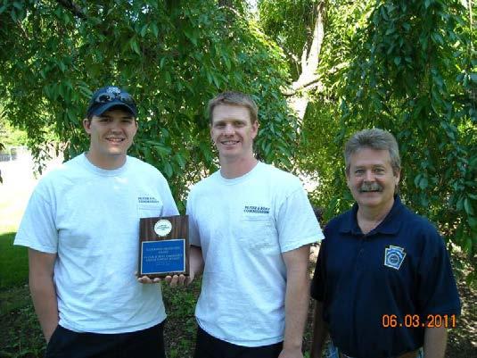 Habitat Manager Mark Sausser, who coordinated the on-site work, and Karl Lutz, Stream Section Chief, accepted the award.