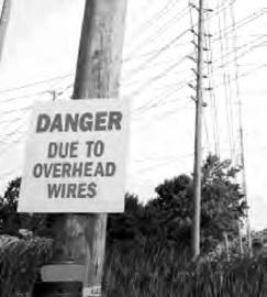 Prepare for work that must be done in close proximity to energized powerlines by developing written procedures ahead of time. Have overhead powerlines moved, insulated, or de-energized where possible.