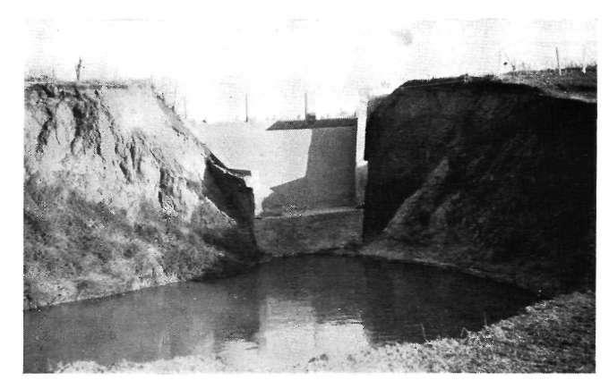 undermining of the spillway.