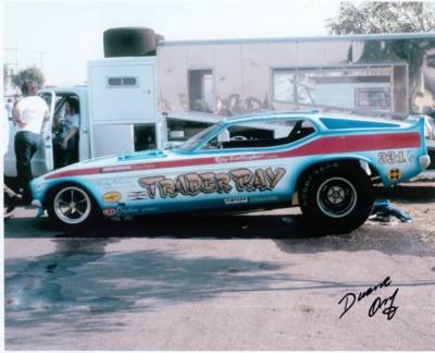 The serial number is 418. The ramp cover includes plexiglass windows. While hauling across the country, motorists could see Trader Ray emblazoned on the side of the funny car.