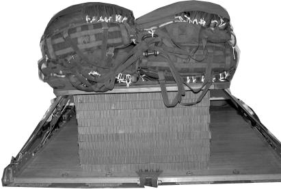 3 5 4 3 3 Set two parachutes side by side on the load with the riser compartments down and with bridles toward the rear of the platform.