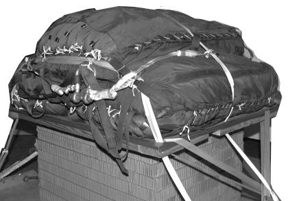 b. Three to Five Parachutes. The restraint system for three to five cargo parachutes consists of two lengths of type VIII nylon webbing (restraint strap) and two multicut parachute release straps.