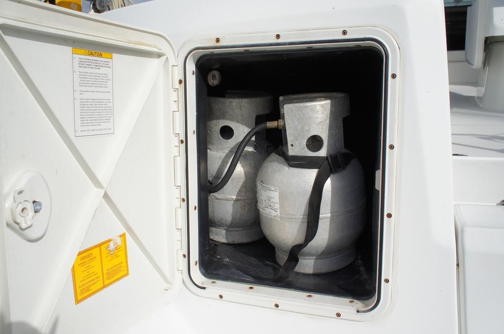 18 Propane and Stove The propane locker is located on the port side of the transom. Do not change propane tank when BBQ is lit. Usage - Turn on the gas solenoid switch on your instrument panel.
