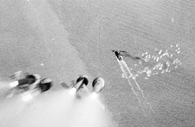 Figure 9: A British Hawker Typhoon's rockets raining down on a tug caught in the Scheldt estuary, September 1944 [22