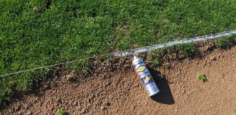 A can of striping paint or field marking paint is used.
