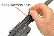 Prior to installing the TRIGGER HOUSING ASSEMBLY, verify that the MAGAZINE EJECTOR SPRING is positioned properly (see FIGURE 15) and the SAFETY is still in the FULL SAFE position.