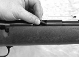 Moving the bolt handle forward and down will push the cartridge into the chamber. WHEN THE BOLT IS FULLY CLOSED, A LIVE CARTRIDGE WILL BE IN THE CHAMBER.