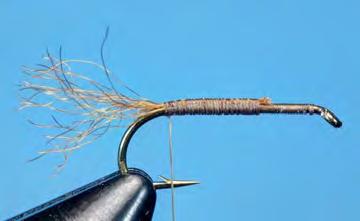 Lash the tail fibers to the hook shank, finishing above the hook barb.