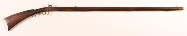 41"" 12 Ga. round musket barrel, curly maple stock, brass trigger guard and butt plate, 57"" long overall. Condition: Poor to fair, original was flint mechanism, barrel not original.