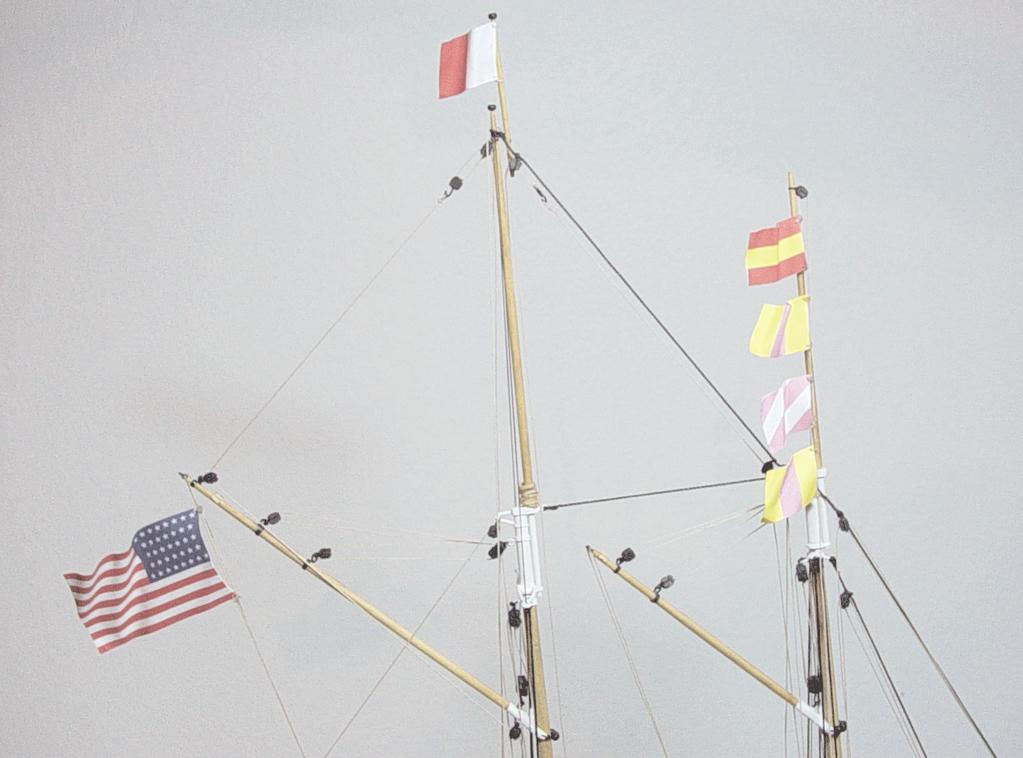 Flag stave can tie a length of tan rigging line to the stave. It should be tied below the flag but not to close to the bottom of the stave end.