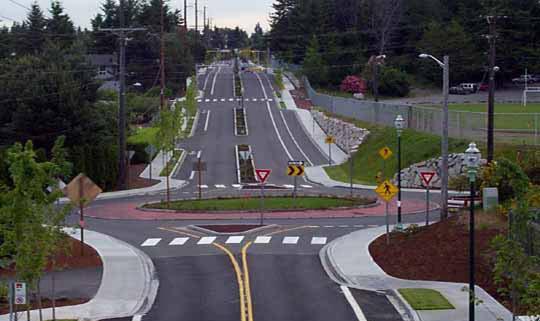 parking, chicanes, modified intersections, textured crosswalks and roundabouts.